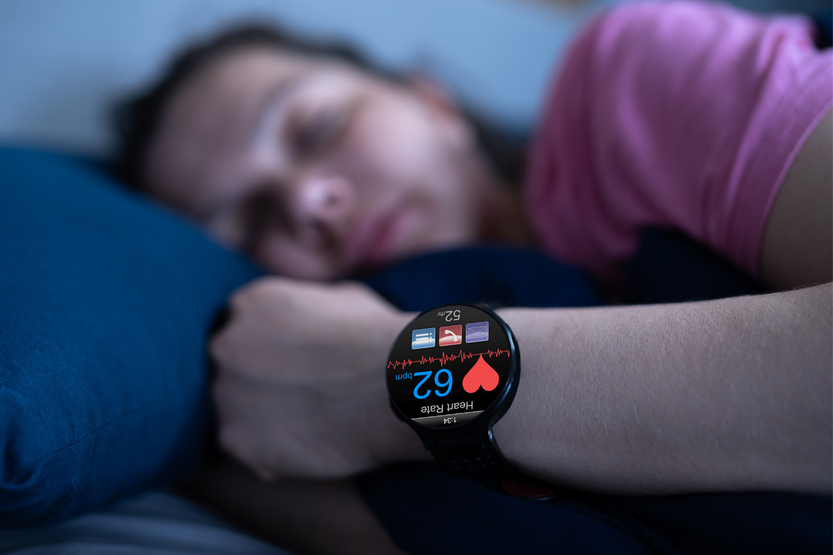 Female asleep with heart rate monitor