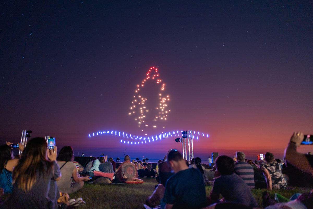 Drone light show at dusk